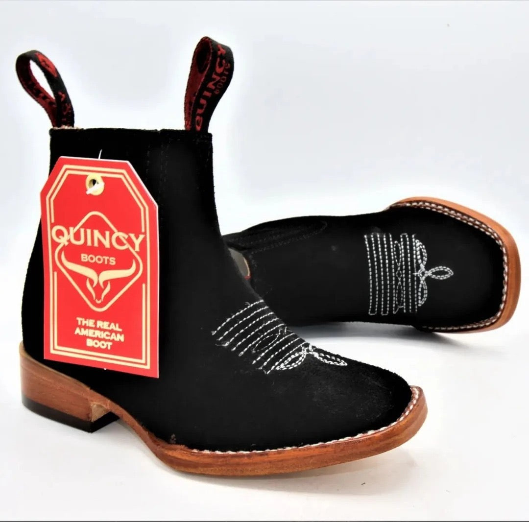 Black boot with brown sole and rhinestone detail, featuring a Quincy Boots tag on a white background.