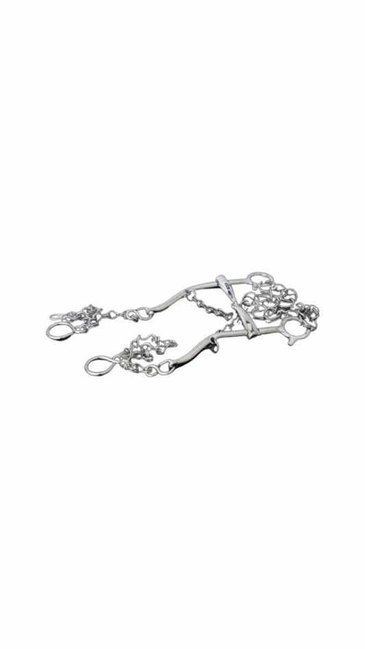 A silver-colored horse bridle with intricate decorations and a luxurious finish.