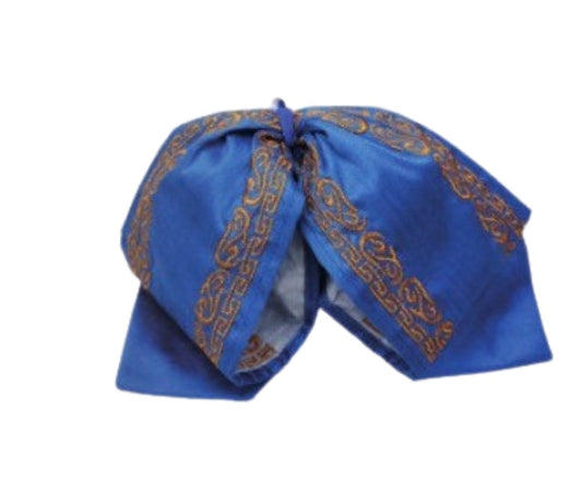 A traditional Mexican charro bow tie in blue with gold embroidery, likely made from satin or a similar fabric.
