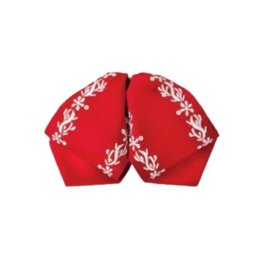 A traditional red charro hat with white diamond patterns.