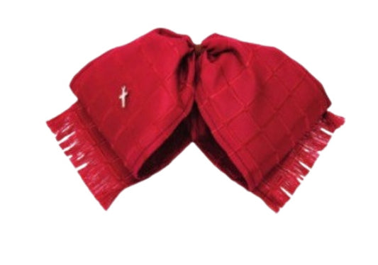 A traditional Mexican charro hat with a red satin base and white diamond pattern, featuring a brooch pin embellishment.