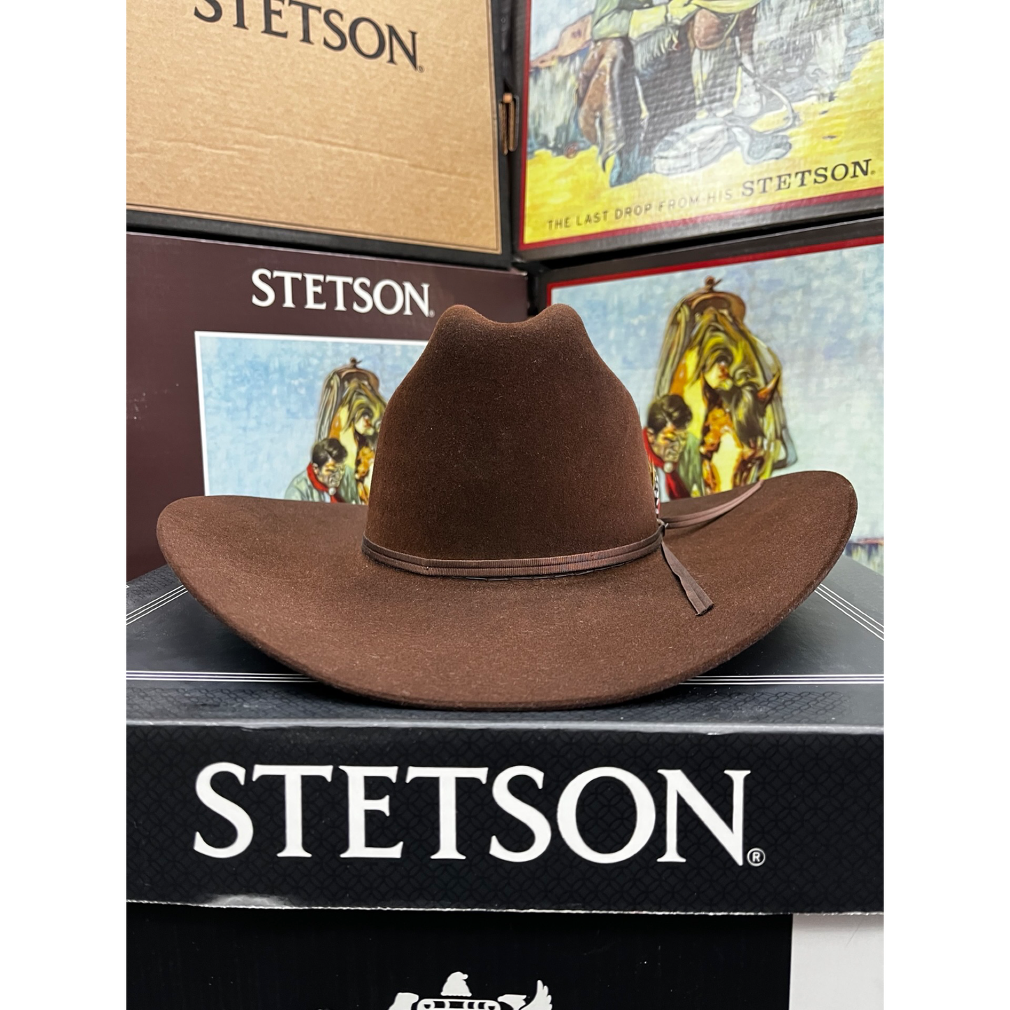 Brown Stetson hat on a black surface with Stetson branding.