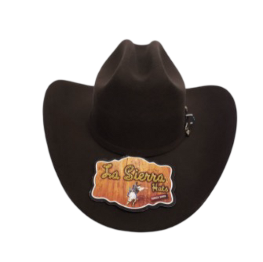 A black cowboy hat with a pin featuring the 'La Sierra 100x' logo.