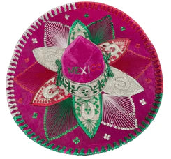 A traditional Mexican Charro sombrero with a pink base and green embroidery, featuring the word 'MEXICO' on the top.