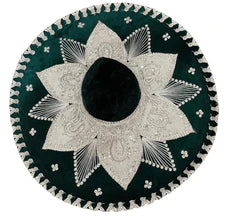 A traditional Mexican Charro sombrero with a floral pattern, predominantly in shades of white and black with green accents.