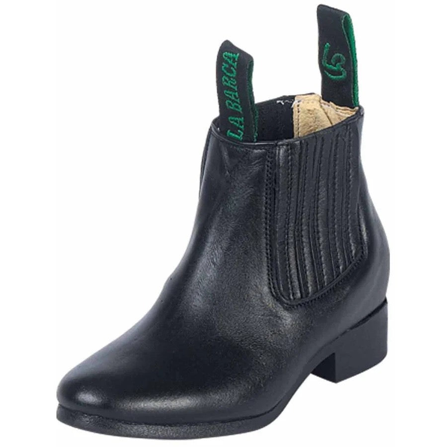 Black leather boot with green interior label on a white background
