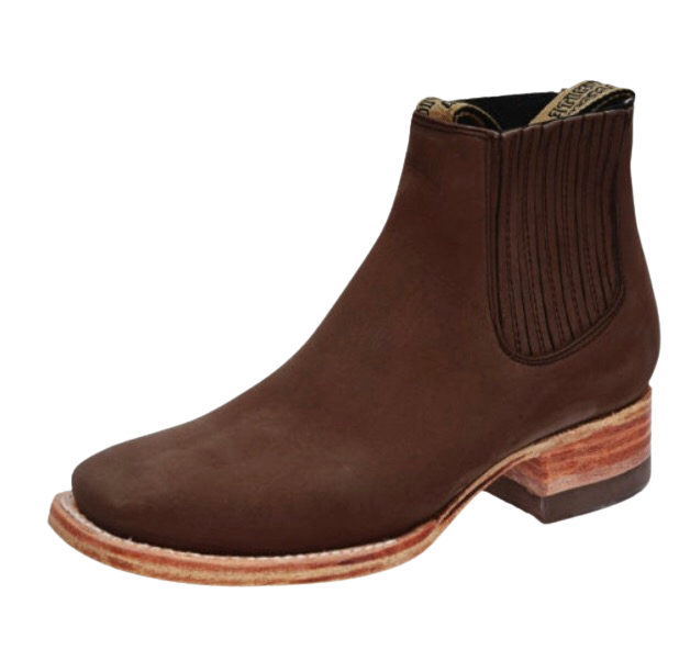 A brown suede chelsea boot with a rubber sole and a elastic ankle panel for children.