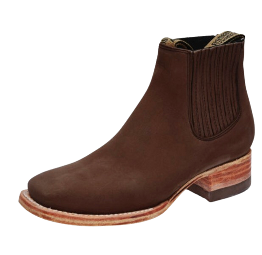 A brown suede chelsea boot with a rubber sole and a elastic ankle panel for children.