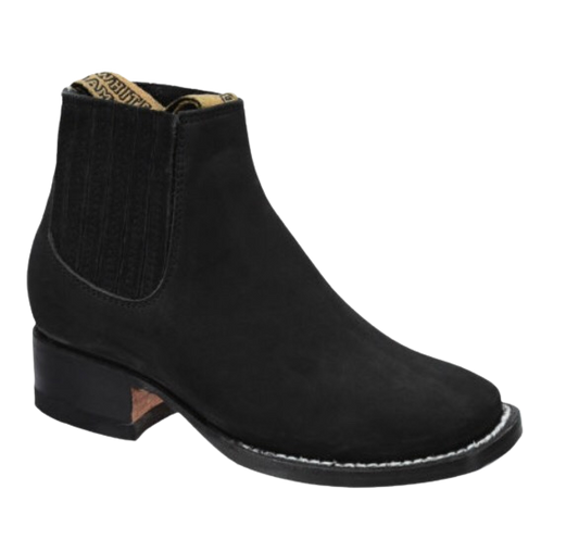 A black suede chelsea boot for kids with a low heel and elastic side panels.
