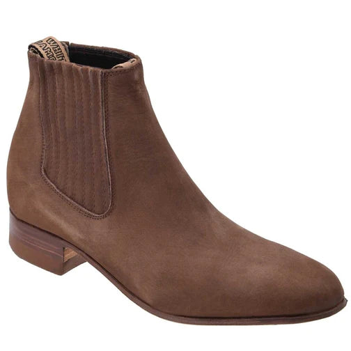 A brown suede ankle boot with a square toe and a low traditional heel, handcrafted with side elastic panels.