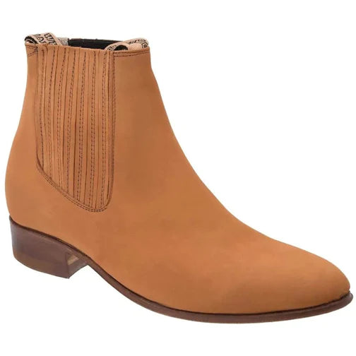 A brown leather ankle boot with a round toe and a low heel, handcrafted on a last.