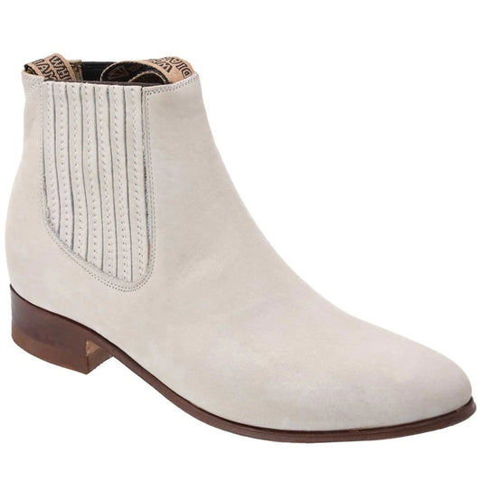 A white ankle boot with a square toe and a low traditional heel, made of genuine leather, featuring side elastic inserts and a pull-up upper.