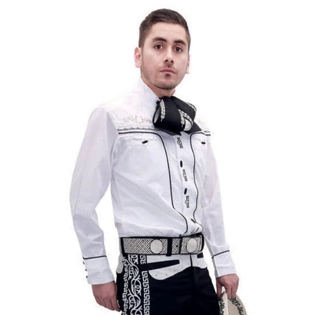 Man wearing a white embroidered shirt with black accents on a white background