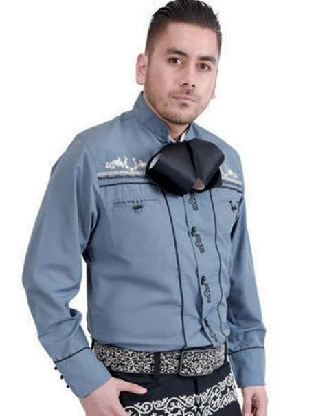 Man wearing a blue jacket with decorative elements on a white background