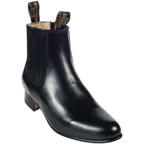 Black leather Chelsea boot with a brand label on a white background