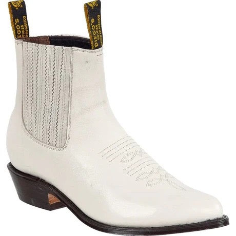 White cowboy boot with brown sole on a white background