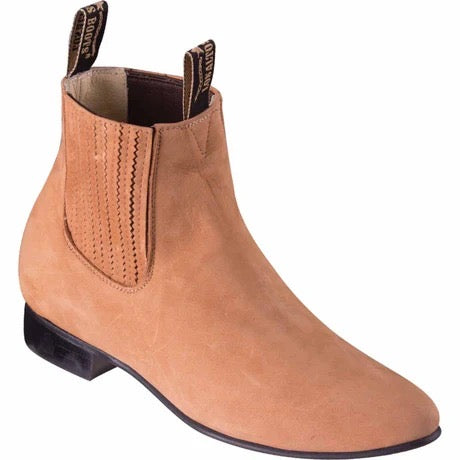 Tan Chelsea boot on a white background
