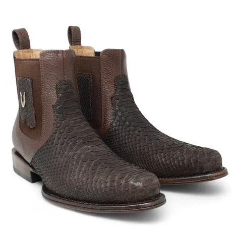 Pair of brown textured boots on a white background