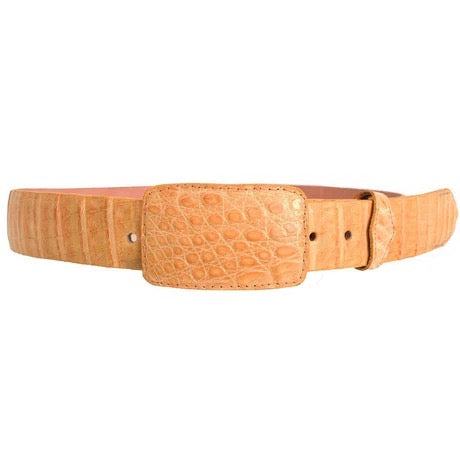 Tan leather belt with a crocodile pattern buckle on a white background