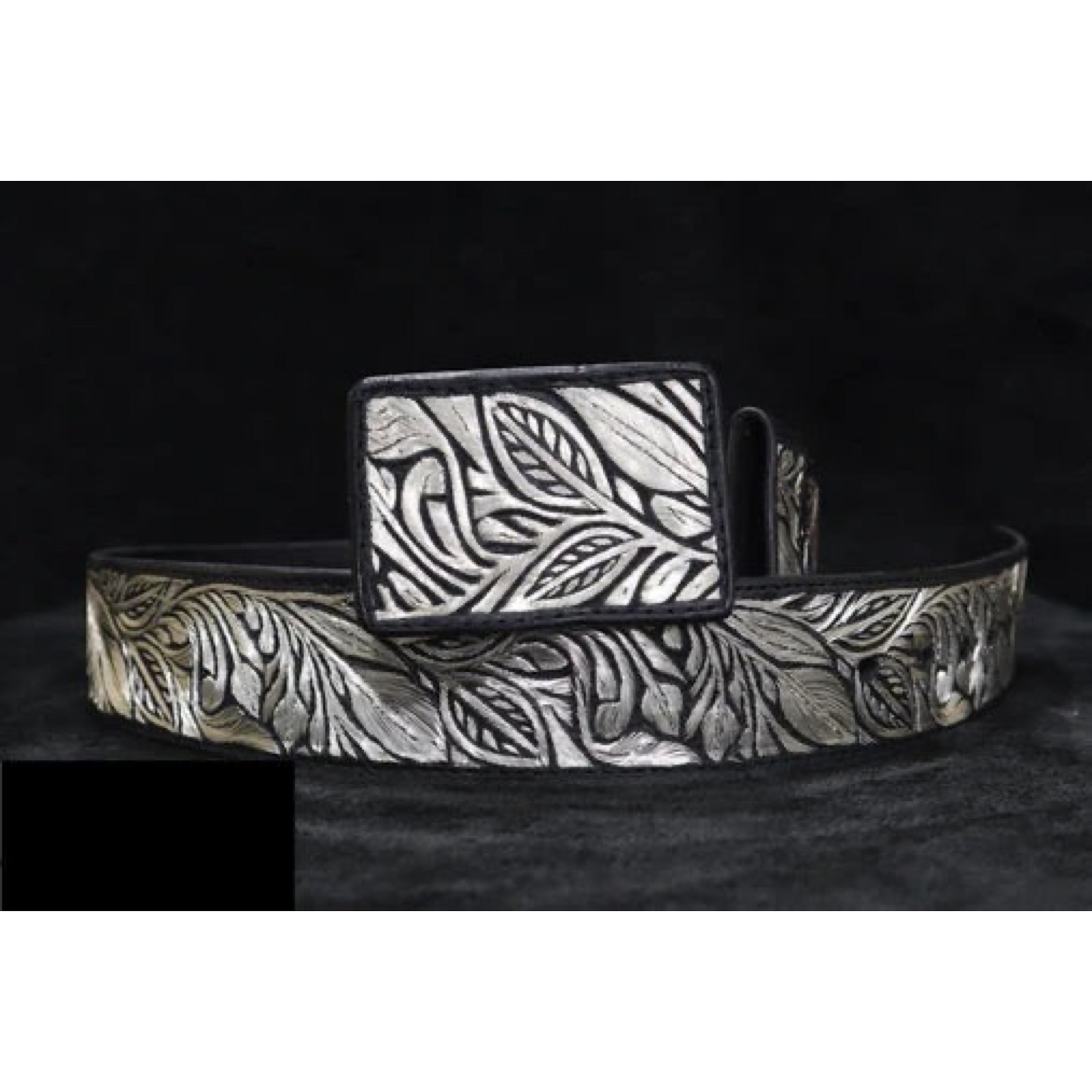 A traditional Mexican 'charro' style belt with silver thread embroidery on a black background, featuring a metallic buckle.