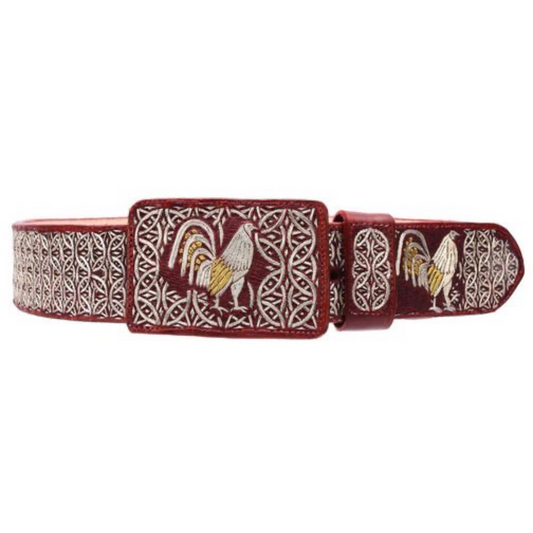 A traditional Mexican 'charro' style belt with silver thread embroidery on a red background, featuring a metallic buckle.
