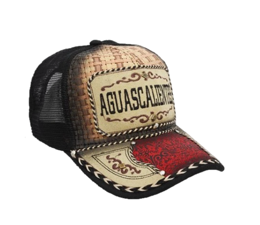 A trucker cap with a western design, featuring a curved visor, structured front panel, and breathable mesh back. It has embroidered text and a red and white geometric pattern.