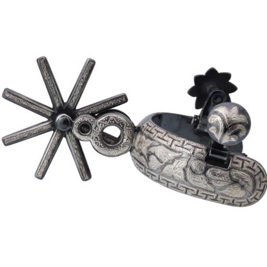 A traditional charro spur with a silver finish and hand-engraved details, featuring a rotating wheel and leather strap.