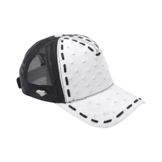 A white trucker cap with black details and a pattern around the brim, featuring a mesh back and a leather strap closure.