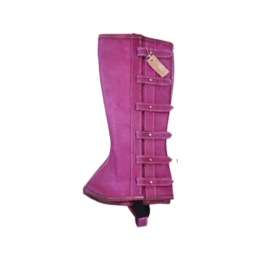 A pink gaiter boot with belt-like straps and a buckle closure, made of genuine leather.