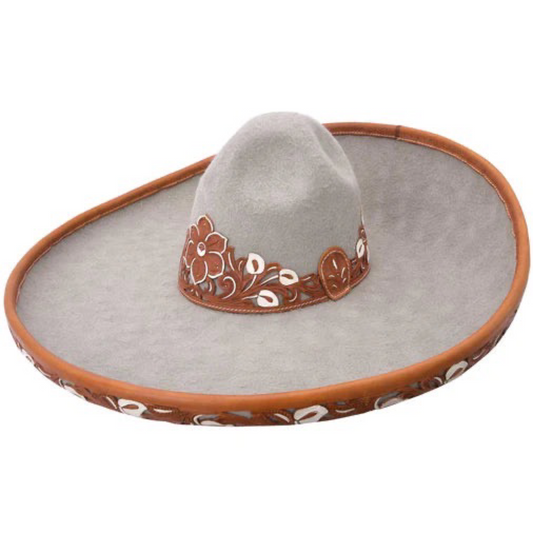 A traditional Mexican sombrero with a white brim and brown crown, featuring embroidered details around the edge.