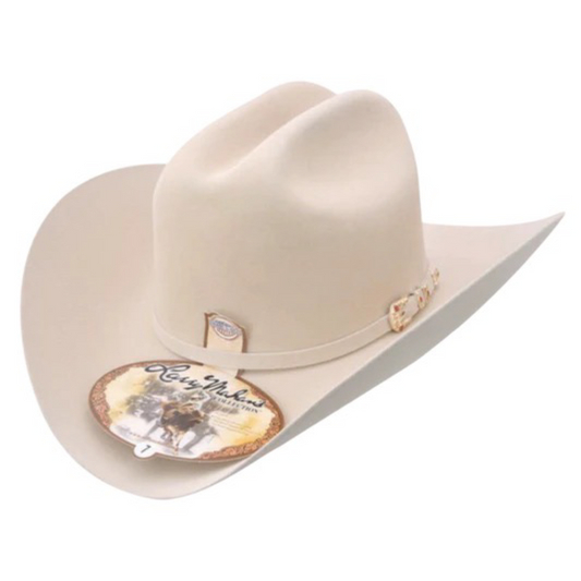 A beige Larry Mahan 10X Estilo Tucson cowboy hat with a classic shape and a wide brim, featuring a leather band and metal buckle detail.