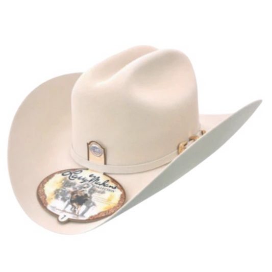 A beige Larry Mahan 5X Estilo Dorado cowboy hat with a wide brim and a golden buckle on the band, displayed against a white background.