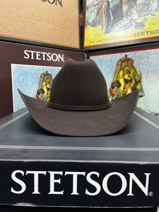 Brown Stetson hat on a display stand with Stetson branding.