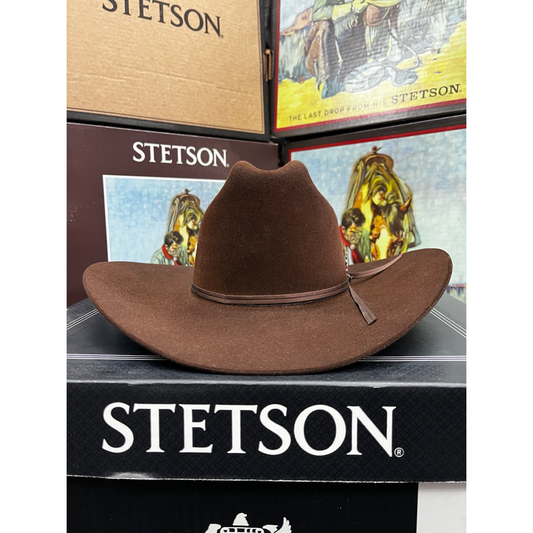 Brown Stetson hat on a black surface with Stetson branding.