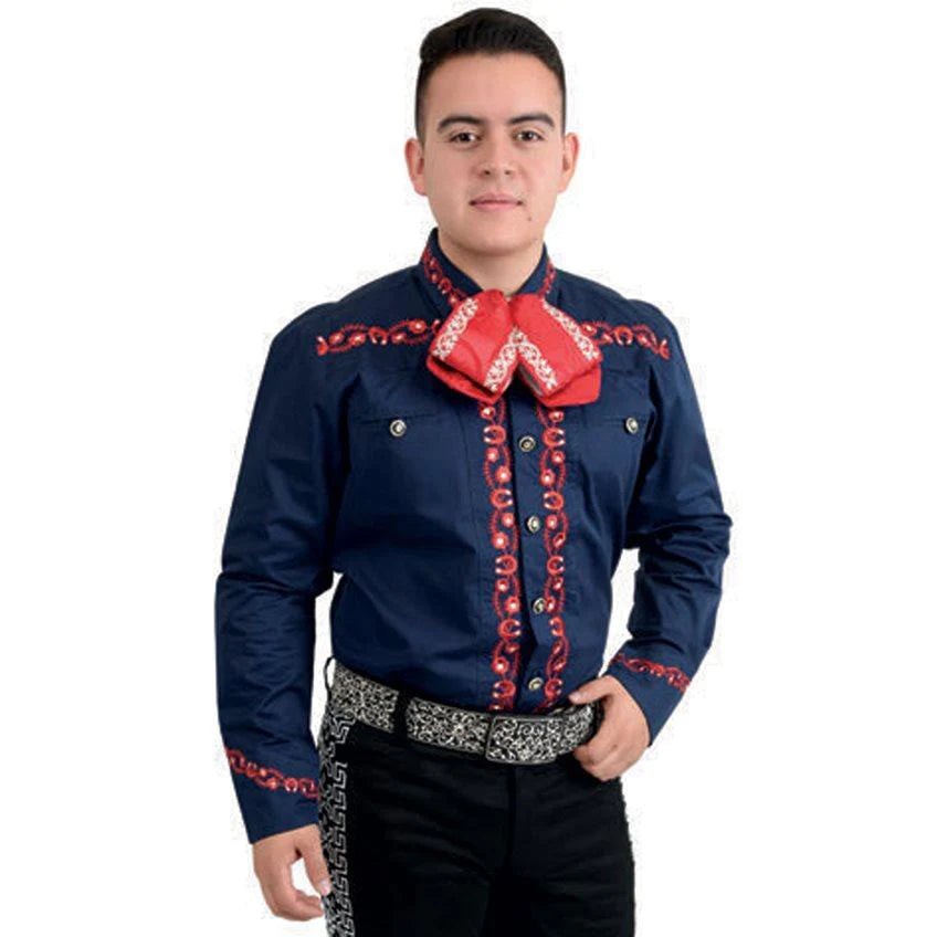 A man wearing a traditional Charro shirt with red embroidery and unique buttons, paired with a belt and trousers.