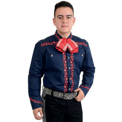 A man wearing a traditional Charro shirt with red embroidery and unique buttons, paired with a belt and trousers.