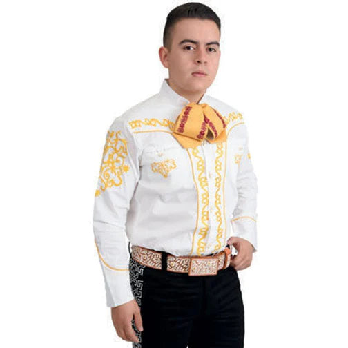 A man wearing a white charro shirt with traditional embroidery and unique buttons, in combination with a belt and black pants.