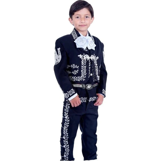 A young boy wearing a traditional charro suit with black jacket and pants, white shirt, and decorative embroidery.