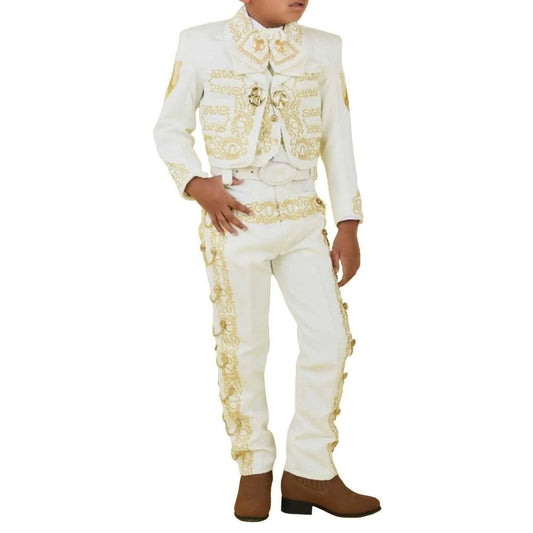 A young man wearing a traditional white charro suit with gold embroidery, including a jacket, pants, vest, white shirt, and a sombrero.