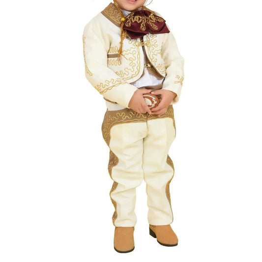 A young boy wearing a traditional charro outfit with embroidery and button details, including a white shirt, pants, a jacket, and a sombrero.