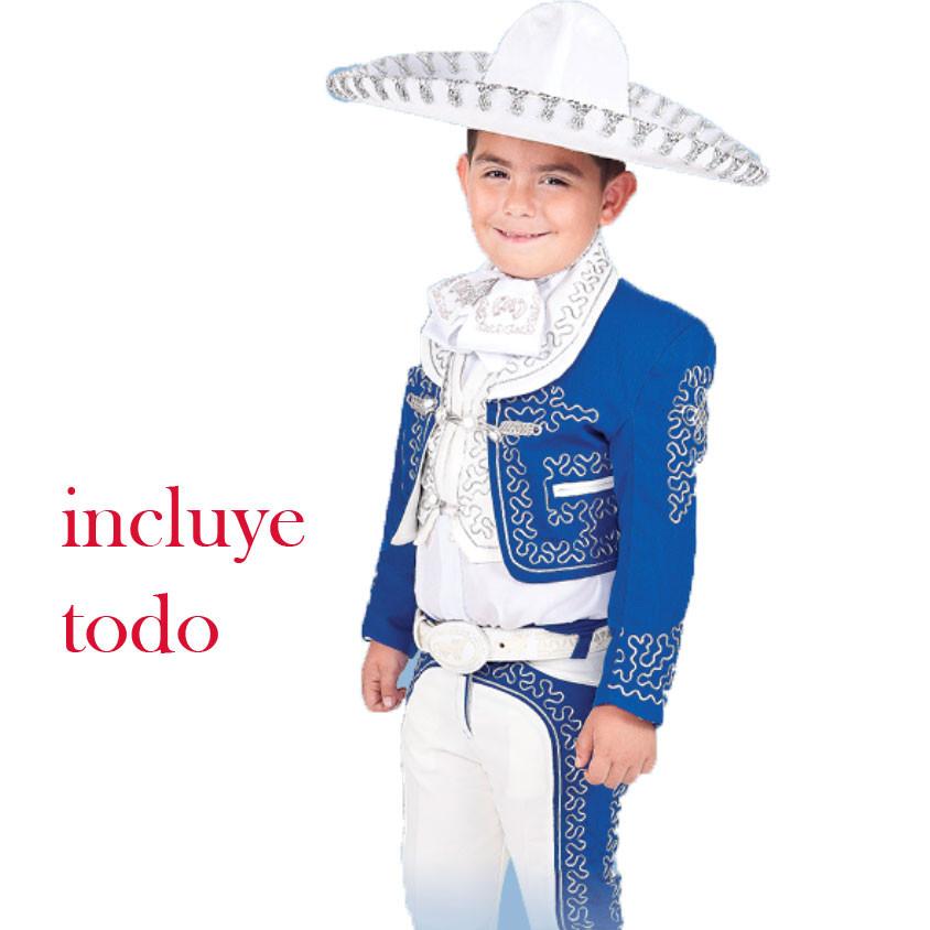 A young boy wearing a traditional charro outfit which includes a white sombrero, white shirt, blue jacket, and white pants with blue and silver details. The text 'incluye todo' is visible, indicating that the outfit includes all necessary items.