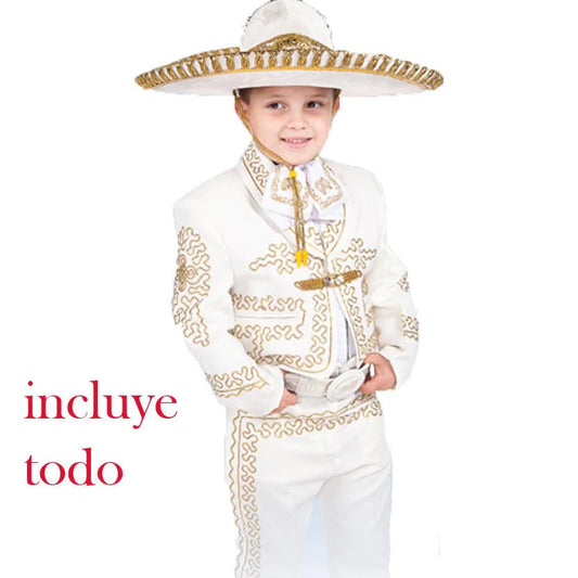 A young boy wearing a traditional charro outfit which includes a white shirt, pants, a jacket, a sombrero, and a belt with a metallic buckle. The outfit is displayed on a white background with the text 'incluye todo' indicating that it includes all necessary items.