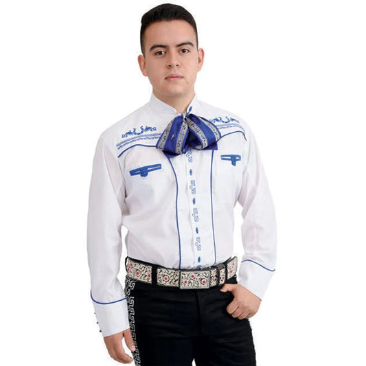 A young man wearing a traditional white charro shirt with blue embroidery, a decorative belt, and black pants.