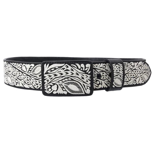 A traditional Mexican piteado belt with white diamond pattern on black leather, featuring a metallic buckle.