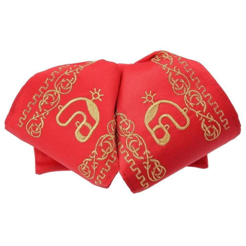 A red traditional charro hat with gold embroidered details.