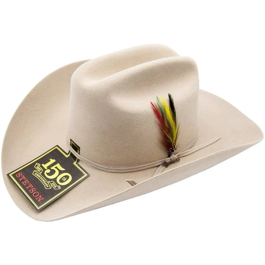 A silverbelly Stetson cowboy hat with a feather decoration on the brim, featuring the Stetson brand tag.